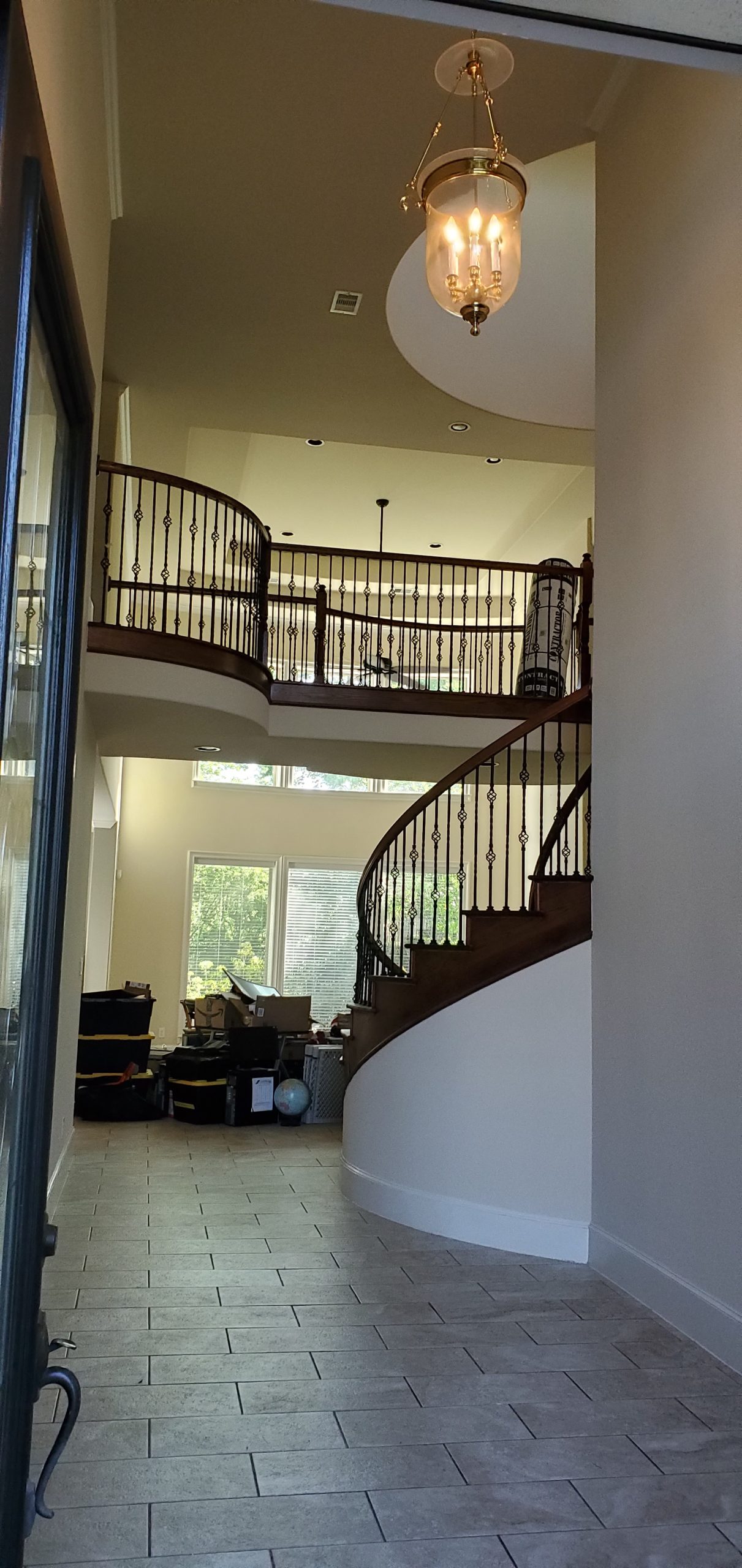 a stair with a beautiful chandelier